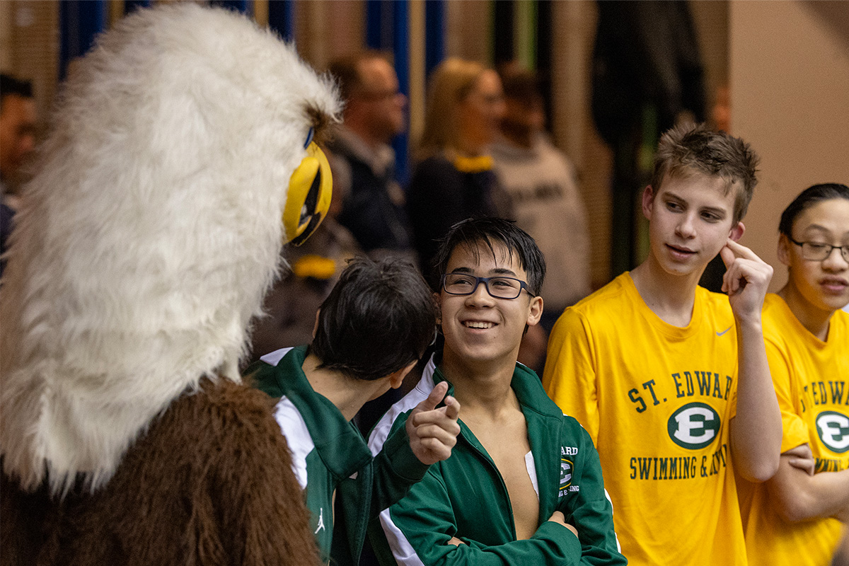 st. edward swimmers between races with eagleman