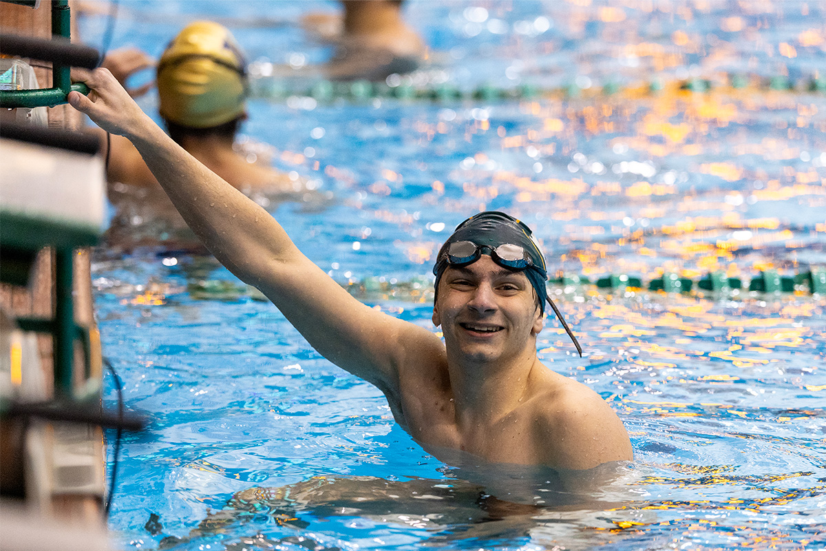 st. edward swimmer smiles at the camera